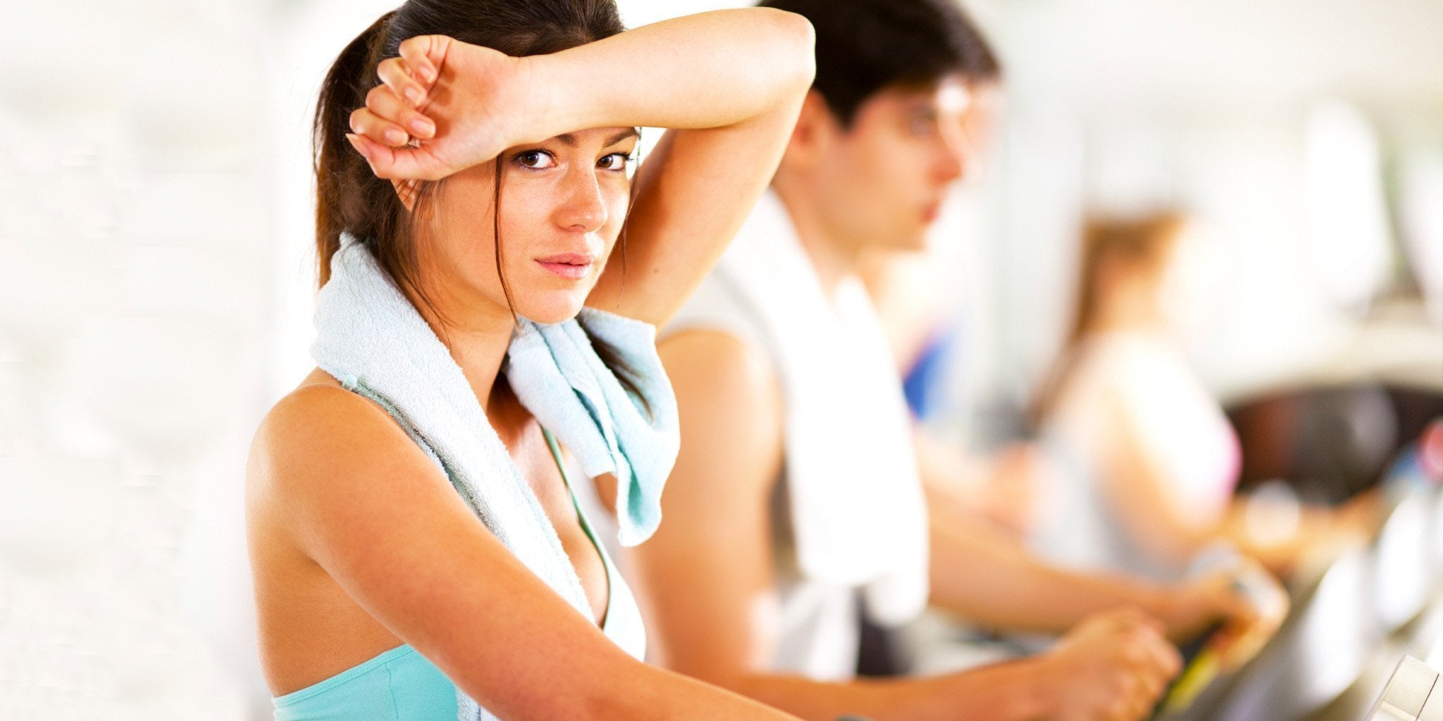 Woman contemplating how often she should wash her workout leggings