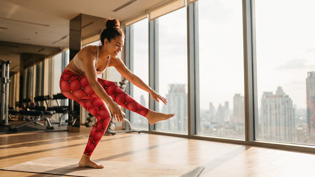 Lifestyle image of a model wearing Quilted Red Leather Leggings from GearBunch