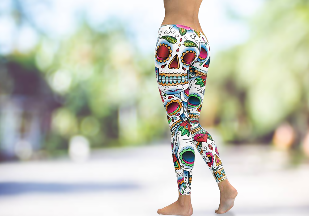 Close-up of colorful sugar skull printed leggings on woman's legs