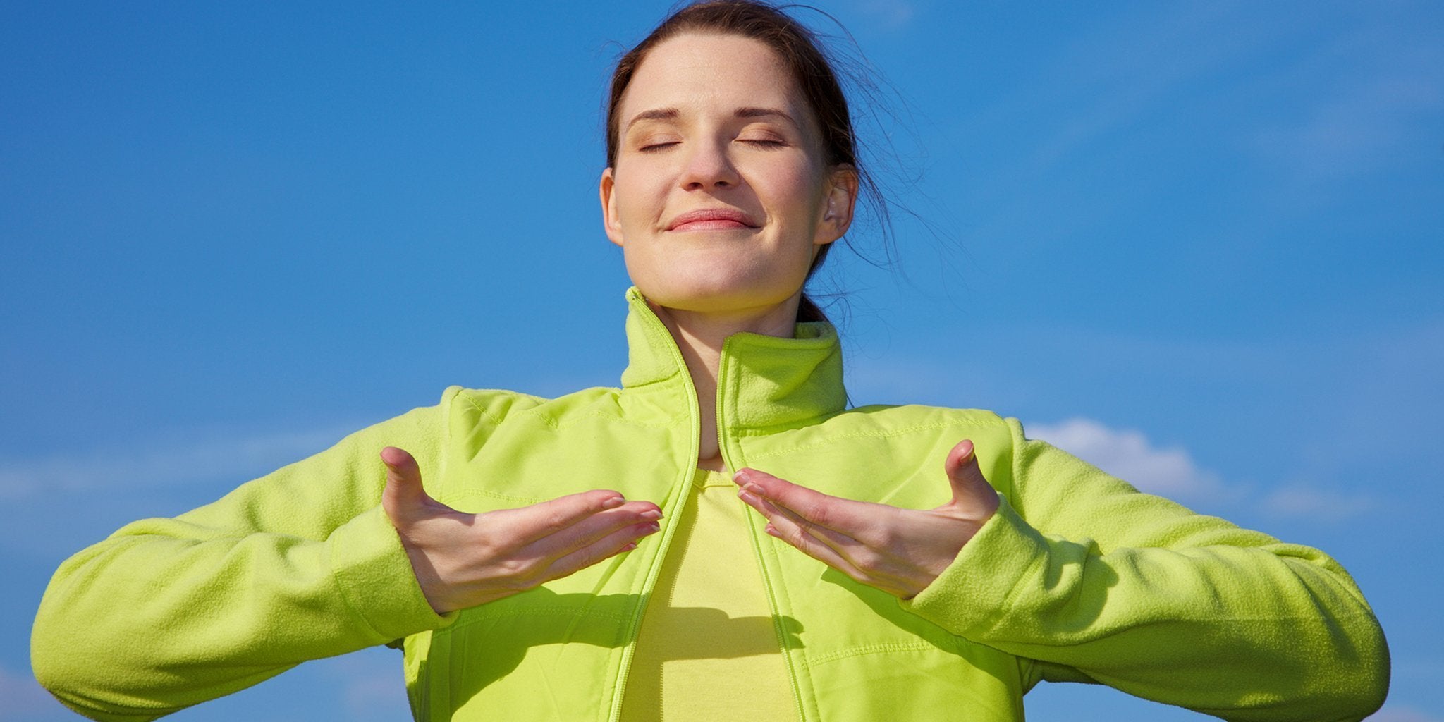 Woman in activewear practicing diaphragmatic breathing during workout session
