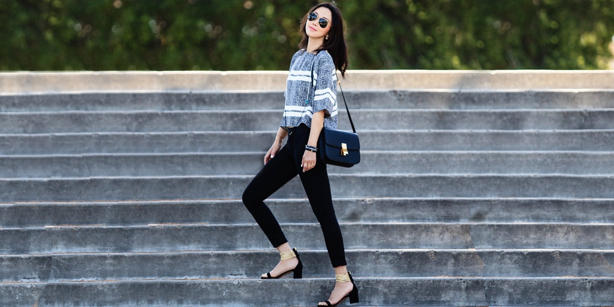 Woman wearing gray chain mail print leggings with blazer at work