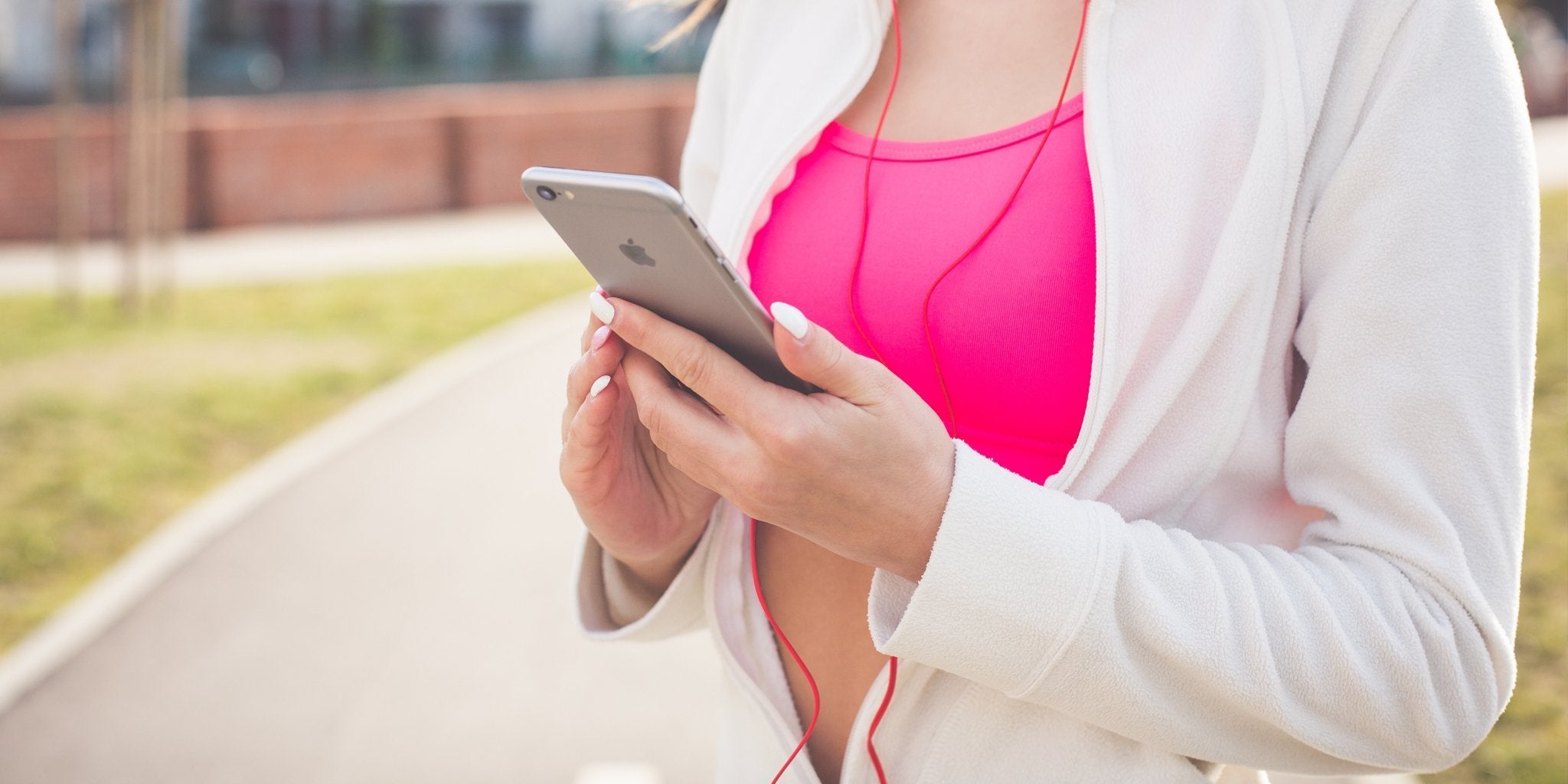Woman doing strength training in workout clothes at modern gym