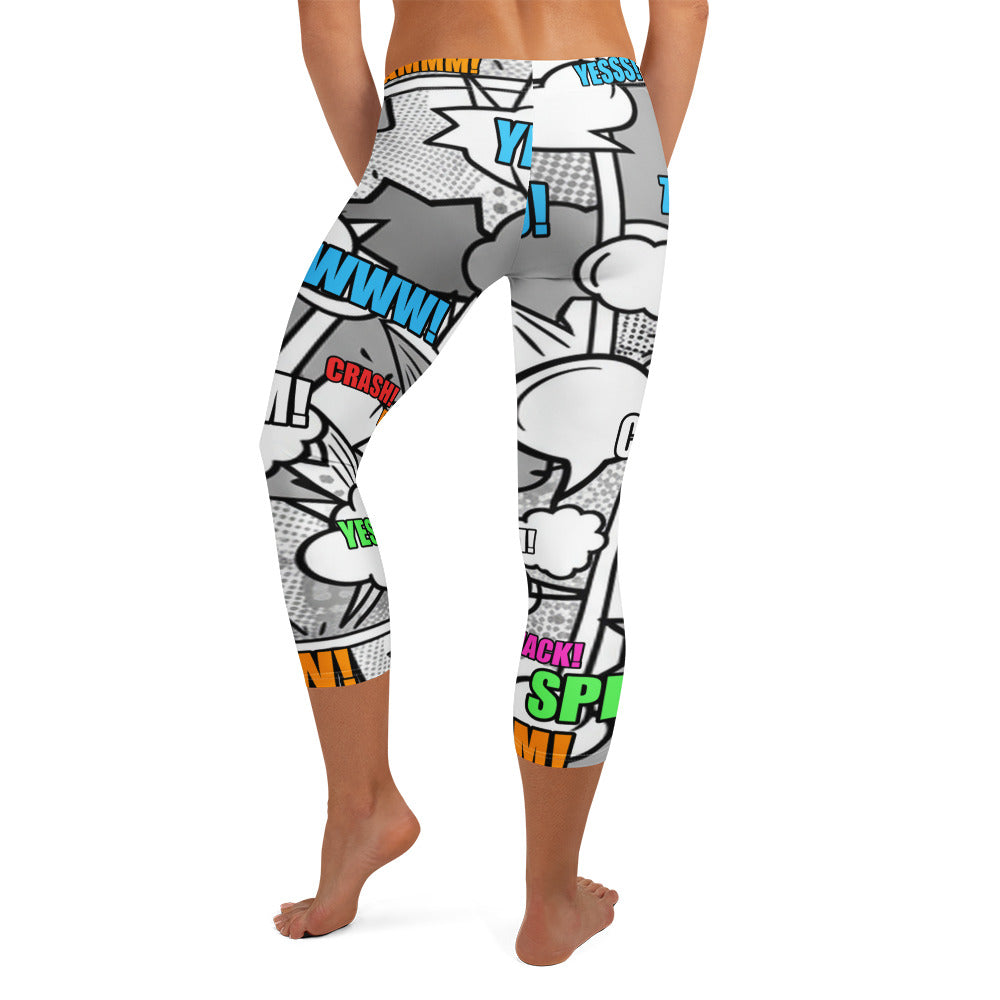 Close-up of the dense all-over comic pop art pattern on GearBunch Capri Leggings, featuring overlapping speech bubbles with action words.