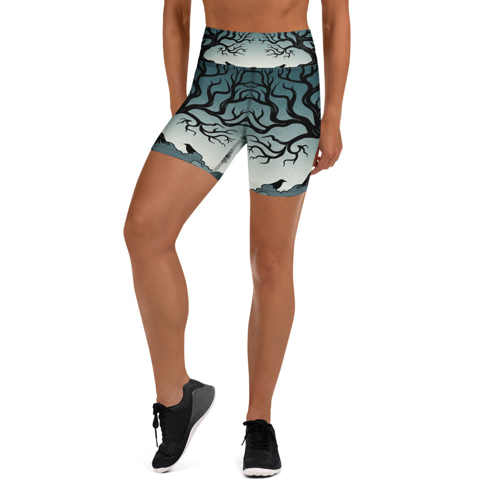 Haunted forest silhouette print GearBunch Yoga Shorts, featuring trees and fog in shades of teal, grey, and black.
