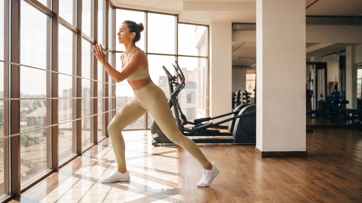 Lifestyle image of a model wearing Solid Light Camel Leggings from GearBunch