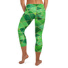 Detailed all-over print of geometric emerald green and gold pattern on GearBunch Capri Leggings.
