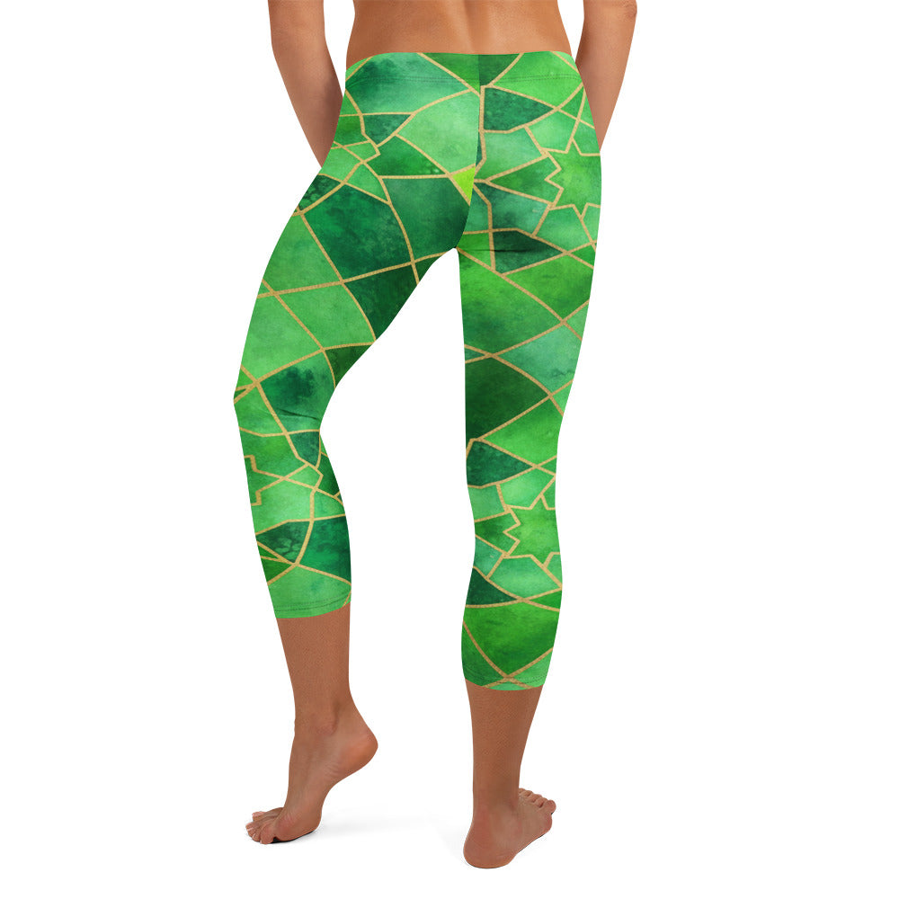 Detailed all-over print of geometric emerald green and gold pattern on GearBunch Capri Leggings.