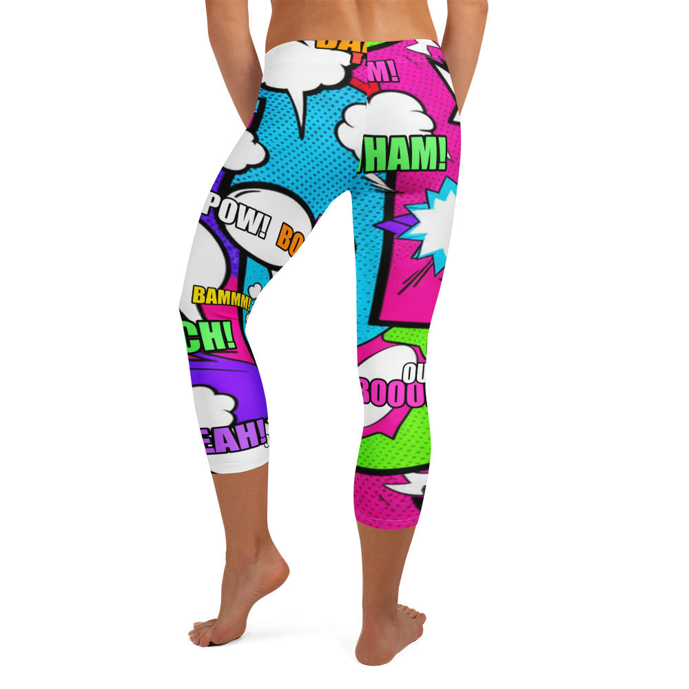Bold all-over print of comic book graphics on GearBunch Comic Pop Neon Pink Capri Leggings.