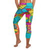Close-up shot of vibrant Comic Pop Tropical Capri Leggings from GearBunch featuring neon colours and comic book sound effects.