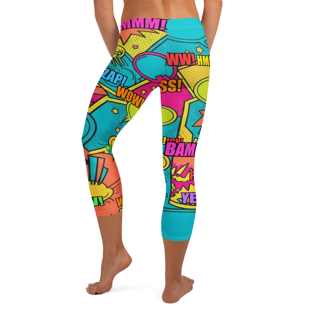 Close-up shot of vibrant Comic Pop Tropical Capri Leggings from GearBunch featuring neon colours and comic book sound effects.