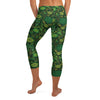 Lush emerald and gold exotic florals cover these GearBunch Capri Leggings in a vibrant jungle print.