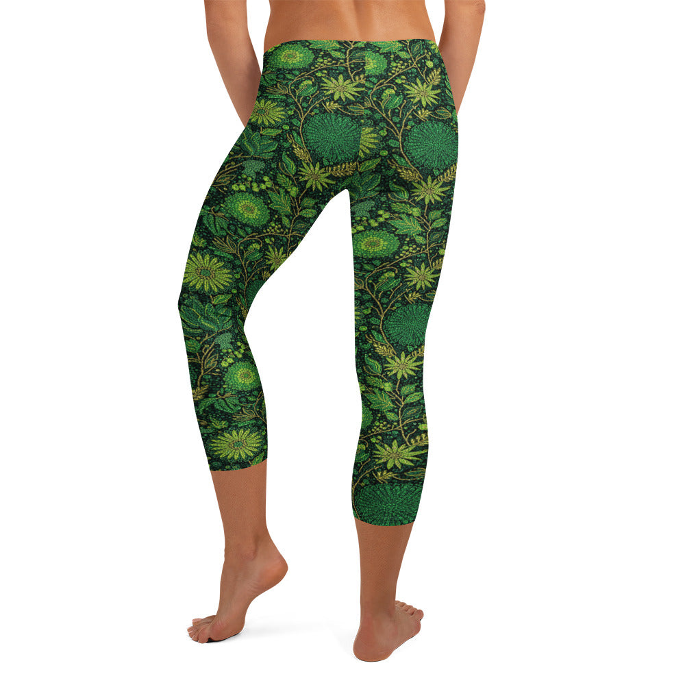 Lush emerald and gold exotic florals cover these GearBunch Capri Leggings in a vibrant jungle print.