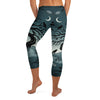 Detailed all-over print of a haunted forest on GearBunch Capri Leggings, midnight teal, fog white, and black.