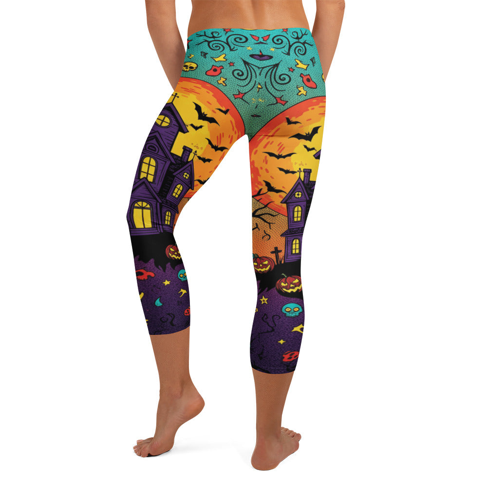 Haunted Manor Twilight Capri Leggings: Electric teal, vivid orange, and midnight purple Halloween design. GearBunch Capri Leggings.