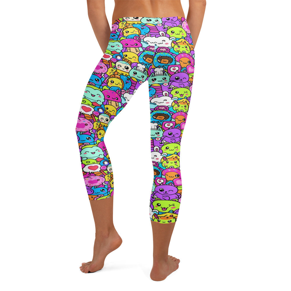 Ultra-vibrant kawaii monster print GearBunch Capri Leggings with neon colours and cute cartoon characters.