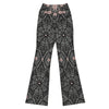 Model wearing intricate Spider Web Lace Flare Leggings from GearBunch. Dynamic print in jet black, smoke grey, and dusty rose.