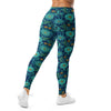Close-up of the Teal Paillette Lotus Garden Leggings showcasing vibrant teal and gold floral designs on a dark blue background, GearBunch Leggings