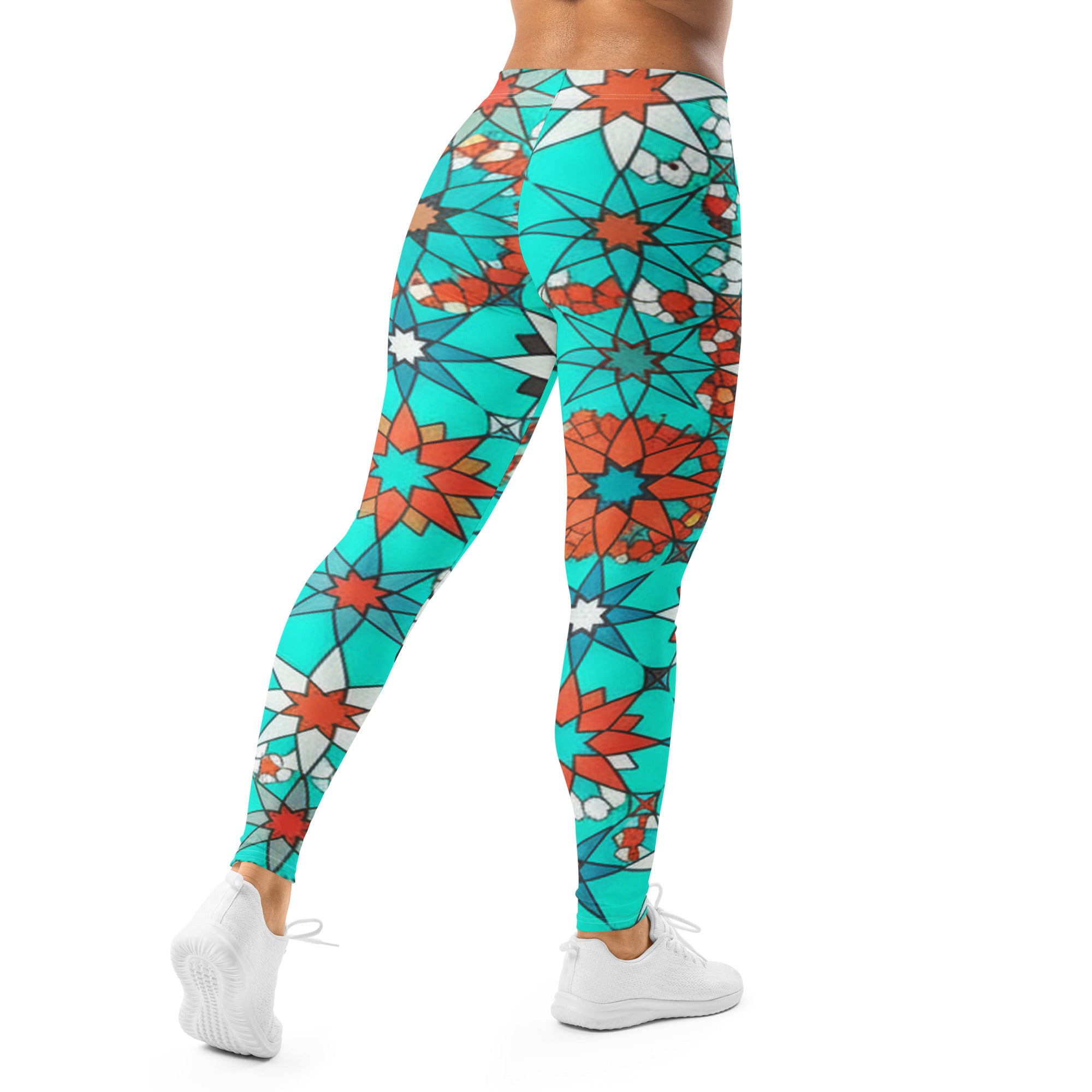 Women's turquoise and coral patterned leggings front view