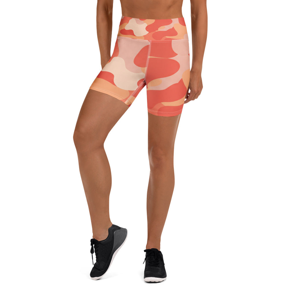 Coral Sunset Camo Yoga Shorts from GearBunch, featuring a vibrant camouflage design in coral, peach, and blush.