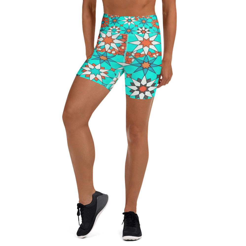 Women's turquoise coral patterned yoga shorts front view