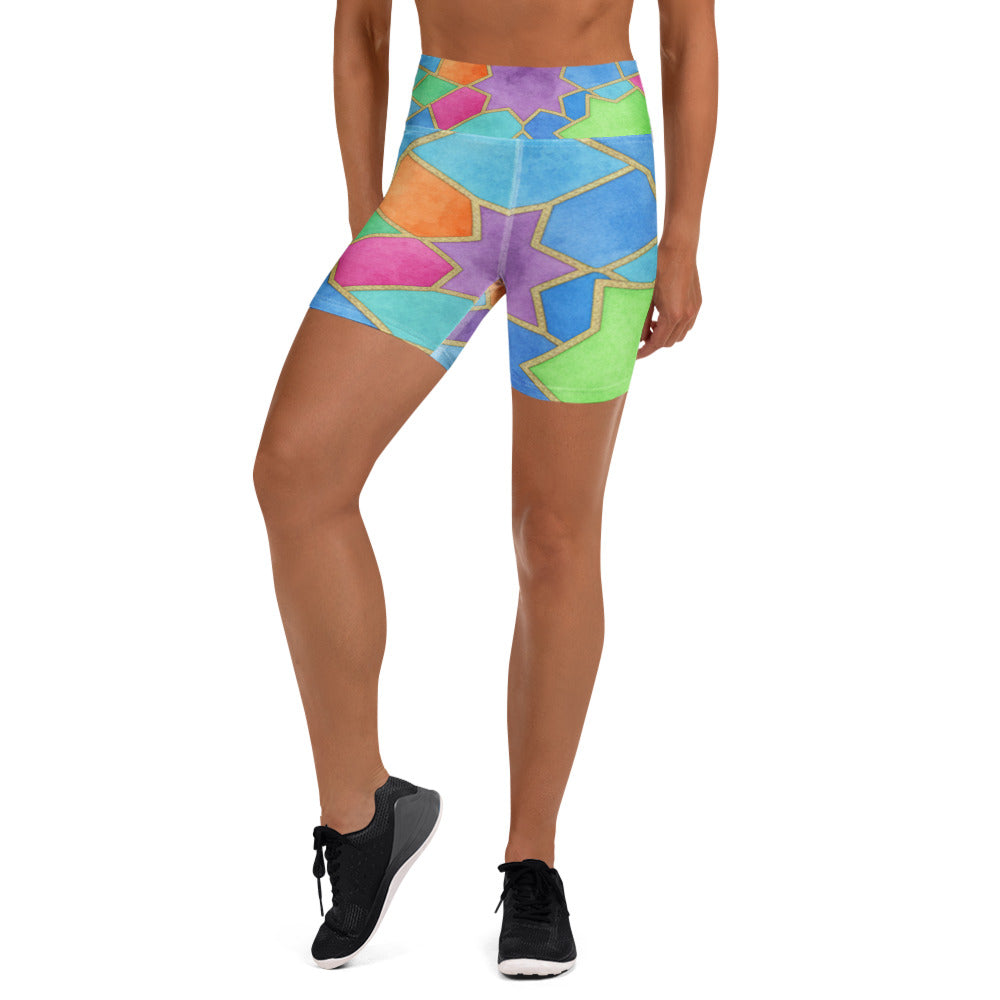 Vibrant geometric design Arabic Festival Yoga Shorts by GearBunch, featuring electric blue, pink, and orange hues.